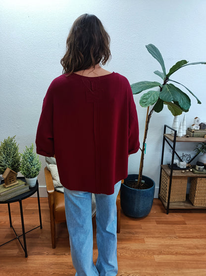 Cabernet Double Knit Exposed Seam Curved Hem Top